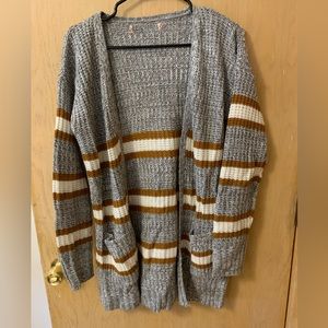 Mustard, gray and white cardigan.